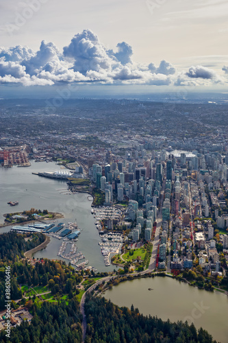 Downtown Vancouver  British Columbia  Canada. Aerial View of the Modern Urban City  Stanley Park  Harbour and Port. Viewed from Airplane Above during a sunny morning.
