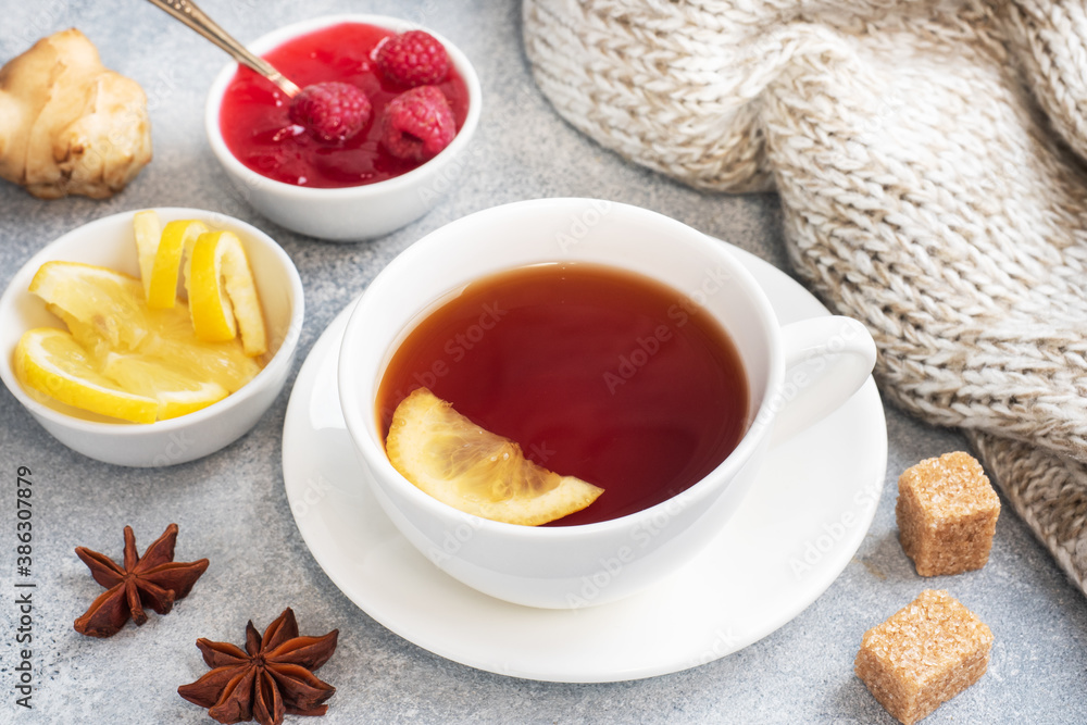 Lemon raspberry jam hot tea. Warming products for the prevention of colds and flu. Copy space. Lemon raspberry jam hot tea. Warming products for the prevention of colds and flu. Copy space.