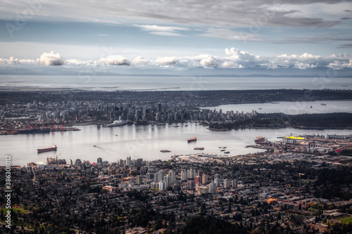 Aerial view of North Vancouver with Downtown City in the Background. Taken during sunny morning in British Columbia, Canada. Artistic Render