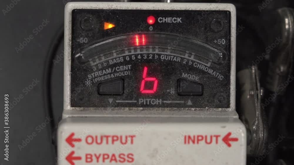 Close up of a guitar tuner being powered on and calibrating lights Close up of a guitar tuner being powered on and calibrating lights