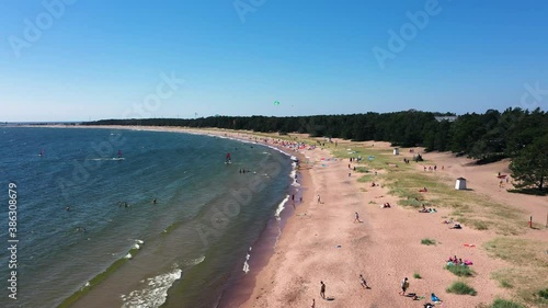 Wallpaper Mural Drone shot of Kite surfers, outside a beach, while people is swimming and enjoying a warm, windy, summer day, in Tulliniemi, Hanko, Finland - static, aerial view Torontodigital.ca