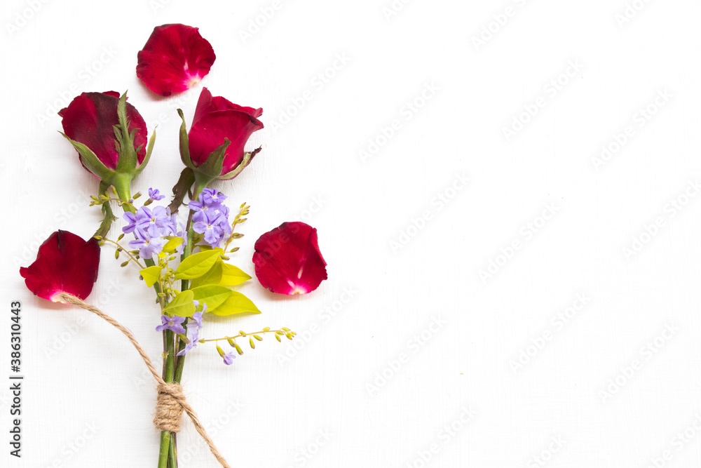 background nature texture red rose and purple flowers arrangement flat lay postcard style on white wooden background nature texture red rose and purple flowers arrangement flat lay postcard style on white wooden