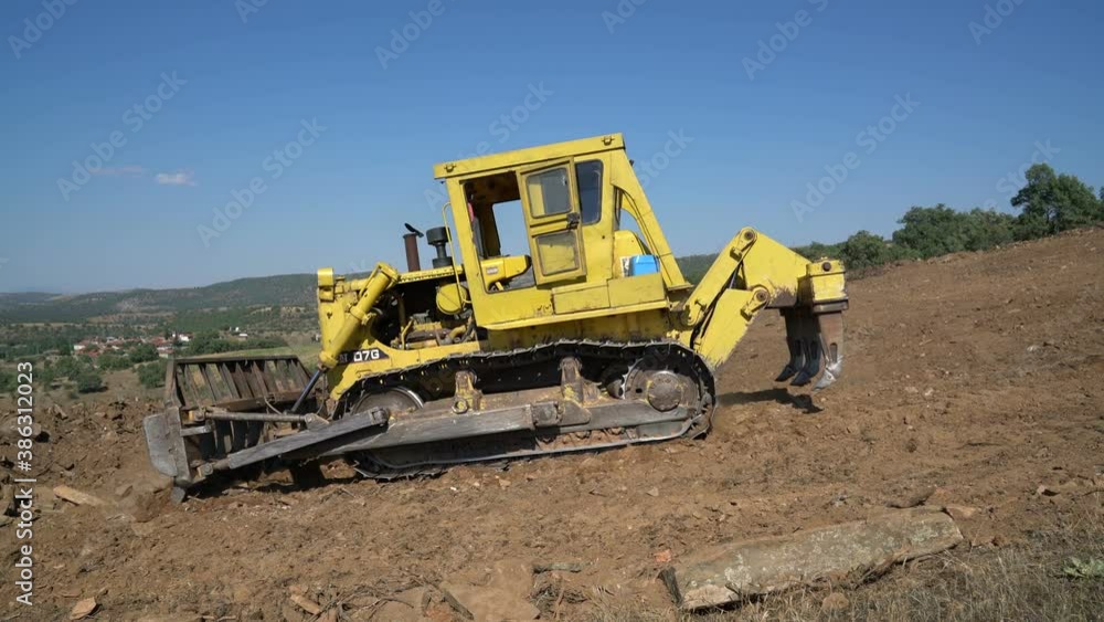Earthworks Dozer (Bulldozer) Excavator in mountainous terrain, land correction and field clearing Earthworks Dozer (Bulldozer) Excavator in mountainous terrain, land correction and field clearing