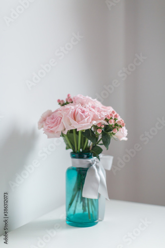 Beautiful flowers in the glass vase.