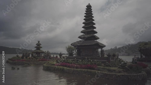 Famous pura ulun danu bratan hindu balinese temple floating on the lake in the mountains region. Bali indonesia. Cloudy day photo
