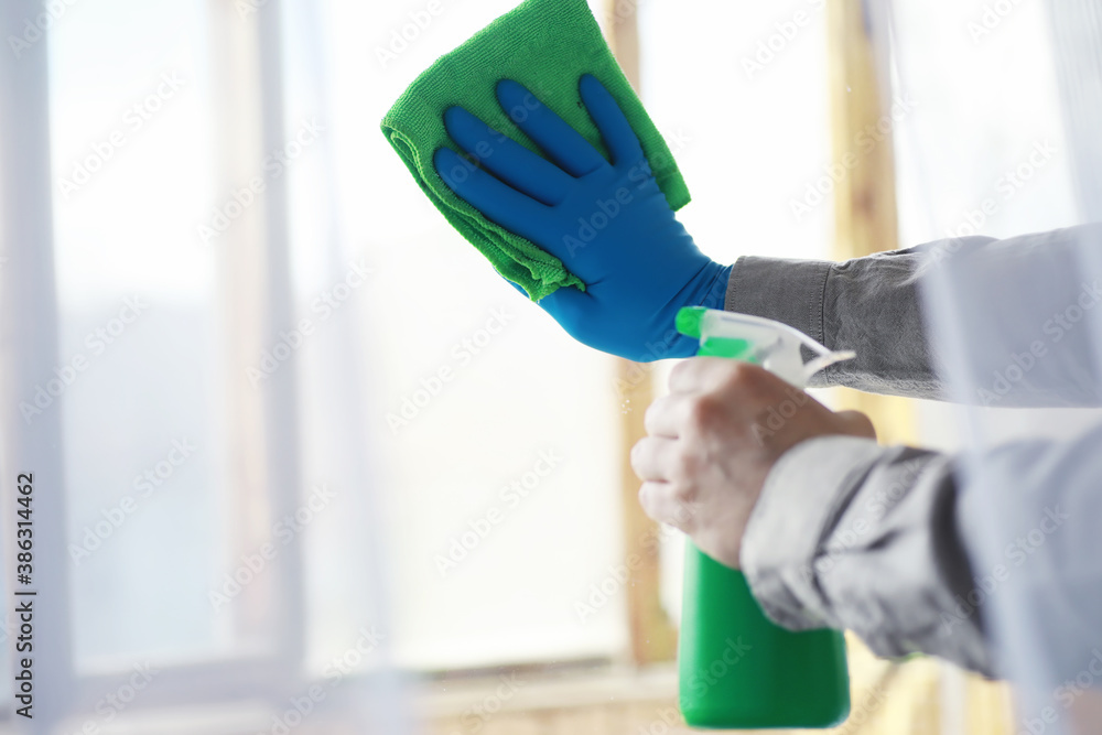 House cleaning concept. Wipe dust off surfaces. Disinfectant treatment of door handles TV electrical. Sanitary treatment at home in quarantine. House cleaning concept. Wipe dust off surfaces. Disinfectant treatment of door handles TV electrical. Sanitary treatment at home in quarantine.