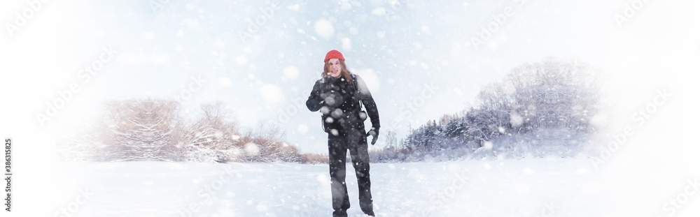 A man travels with a backpack. Winter hike in the forest. Tourist on a walk in the winter in the park. A man travels with a backpack. Winter hike in the forest. Tourist on a walk in the winter in the park.