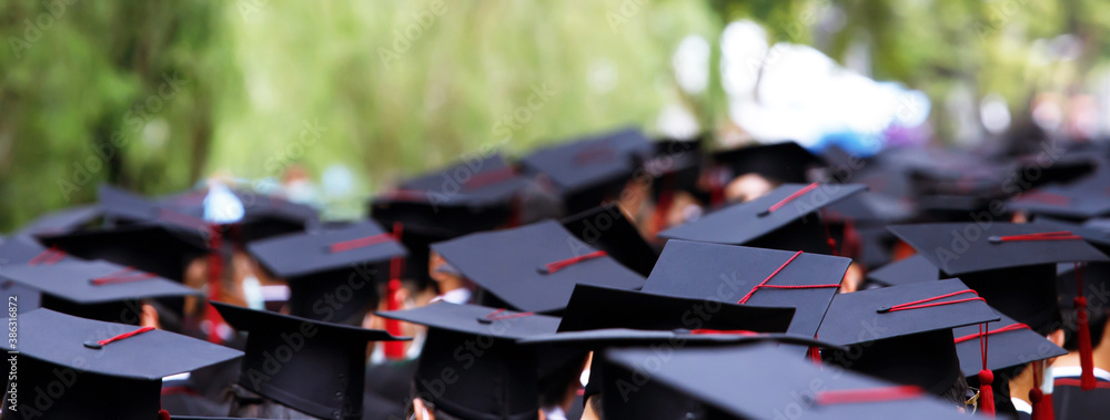 Group of Graduates during commencement stand in row. Concept education congratulation in University. Graduation Ceremony. Group of Graduates during commencement stand in row. Concept education congratulation in University. Graduation Ceremony.