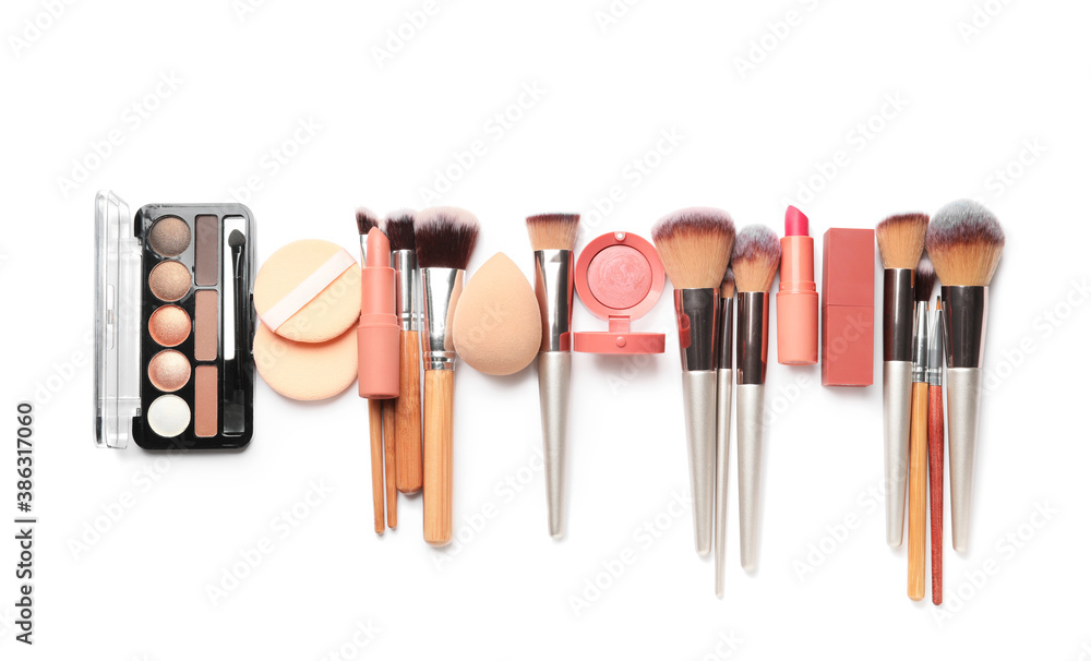 Set of makeup brushes with decorative cosmetics and sponges on white background - obrazy, fototapety, plakaty 