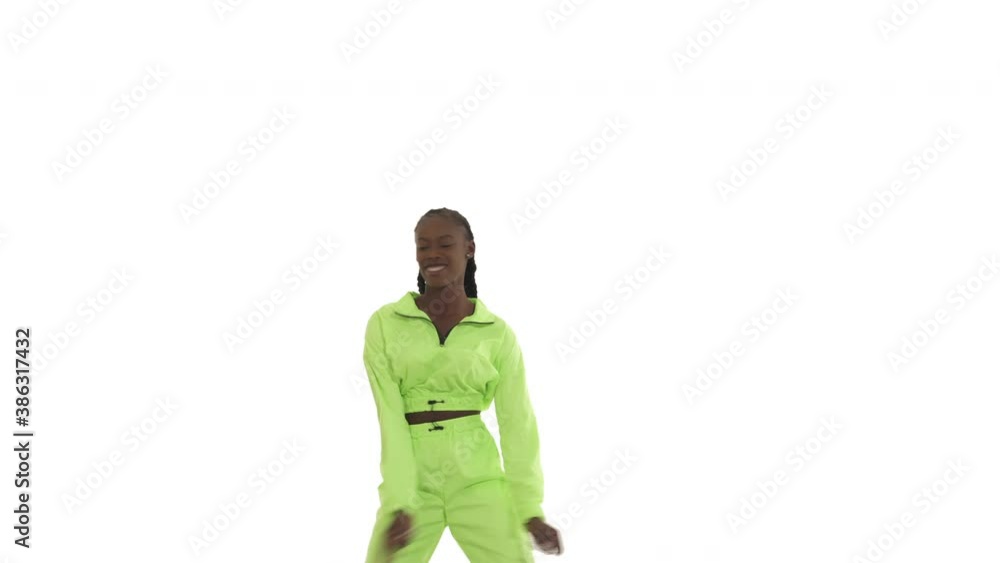 Young African woman performing shaku afro dance move. Dancer swinging her arms and legs. Isolated on white background. Young African woman performing shaku afro dance move. Dancer swinging her arms and legs. Isolated on white background.