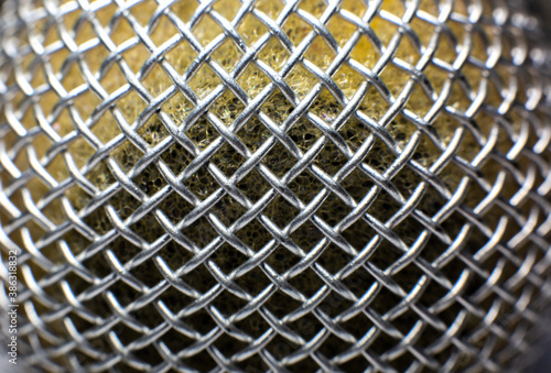 Close up photo of microphone texture. © Vadym