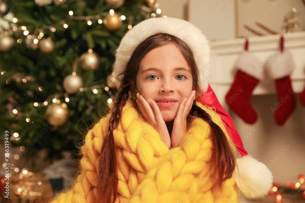 Cute little girl at home on Christmas eve Cute little girl at home on Christmas eve