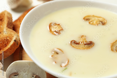 Concept of tasty lunch with bowl of mushroom soup  close up