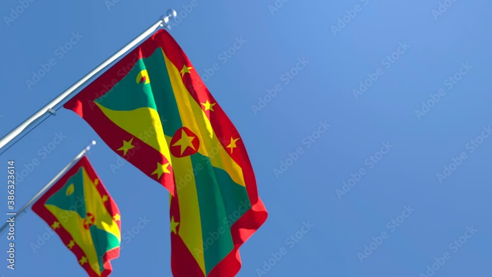 The national flag of Grenada flutters in the wind The national flag of Grenada flutters in the wind