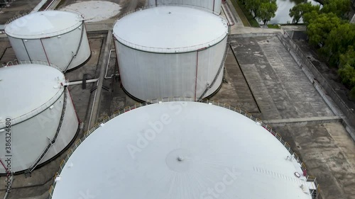 Drone aerial view oil And gas petrochemical industrial and oil storage tank. Oil station and gasoline tank on the ground industrial environmental conservation or issue concept video, Shanghai China