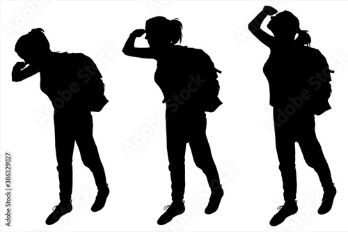 Tourists with backpacks on their backs. The girl is staring out. The woman is watching, helping her hand to focus on the object. Hiking. The female silhouettes are isolated against a white background.