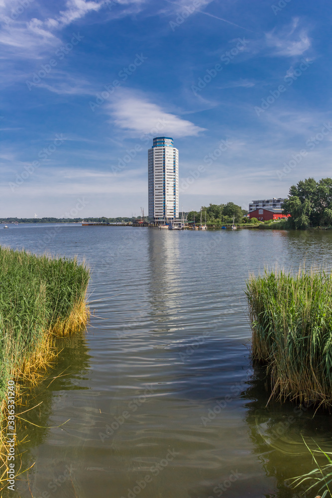 Modern living tower with reflection in the water in Schleswig, Germany