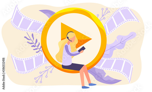 Woman in headphones sitting on video player and working with a phone in social networks on background of purple videotapes. Female character in casual clothes holding device in hands and working