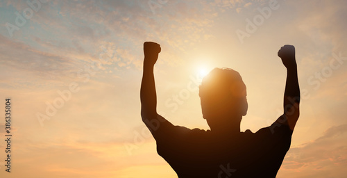 silhouette of business man on the top of the mountain celebrating wining,success concept.