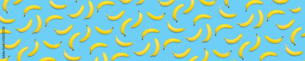 Bananas creative background. pop art bananas background. Tropical abstract background with banana. Colorful fruit yellow banana Bananas creative background. pop art bananas background. Tropical abstract background with banana. Colorful fruit yellow banana