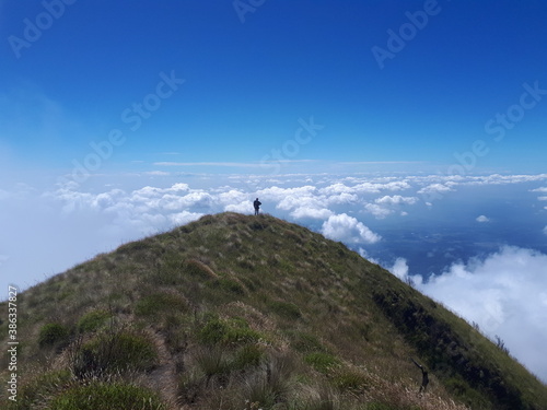 hiker on top of mountain