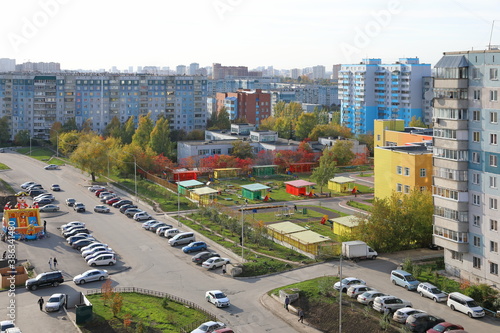 Kindergarten in autumn among residential buildings in Novosibirsk