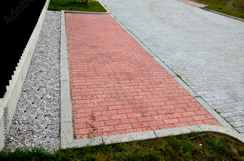 bus stop consisting of a reserved place with the word bus. Horizontal traffic sign white lines. The concrete curb is rounded due to damage to the sidewall of the tire. paving for the blind paving photo