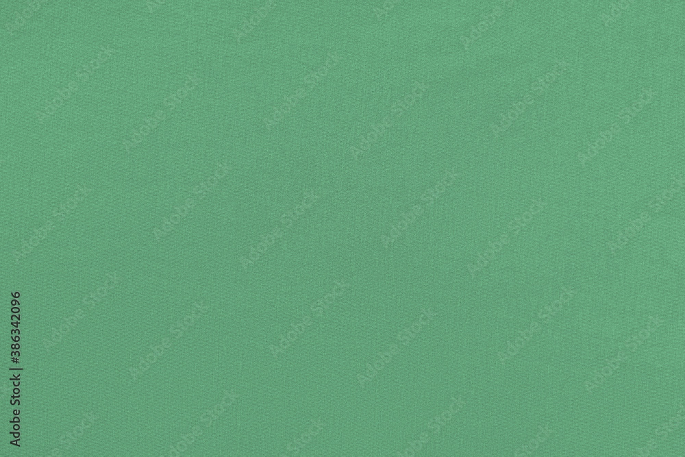 Green homogeneous background with a textured surface, fabric. Green homogeneous background with a textured surface, fabric.