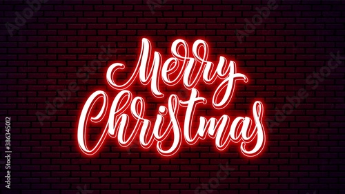Merry Christmas neon lettering. Bright holiday calligraphy. Xmas neon handwritten text.