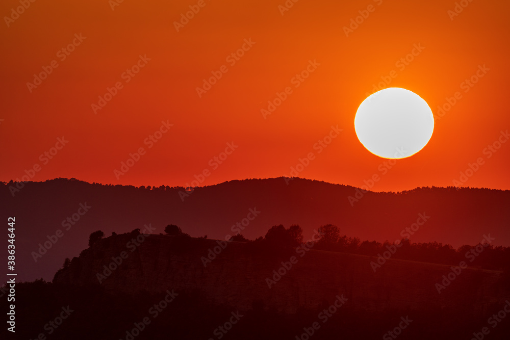 Orange sunset and mountain range with text space on top