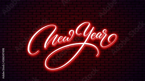 New Year neon hand drawn lettering. Glowing holiday calligraphy isolated on wall background. Happy New Year neon text design.