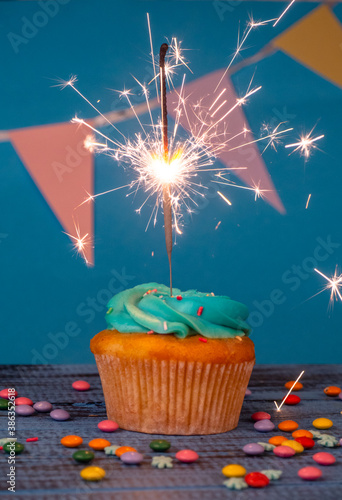 Birthday or christmas cupcake with a sparkler