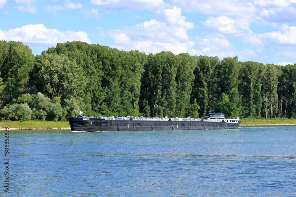 Inland shipping transport on the rhine river near germersheim Inland shipping transport on the rhine river near germersheim