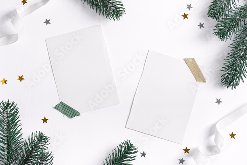 Christmas card with fir twigs, confetti and mockup letter.