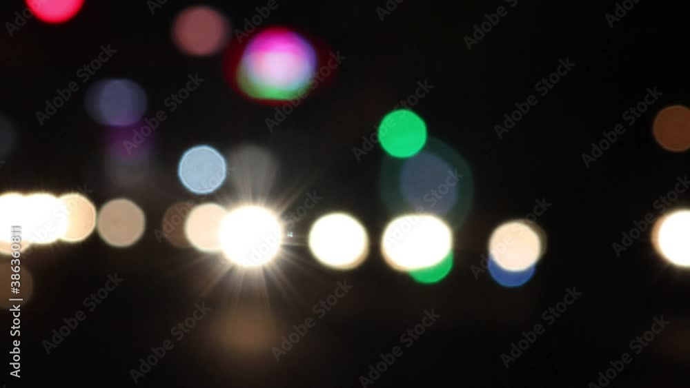 Blur effect vehicle and traffic light with multicolour defocused background Blur effect vehicle and traffic light with multicolour defocused background