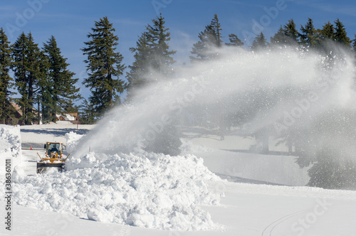 Now that's a snow blower! With 10-15 feet of snow a year, snow blowing is a full time activity to keep the roads clear for visitors at Crater Lake National Park. Oregon. © PKZ