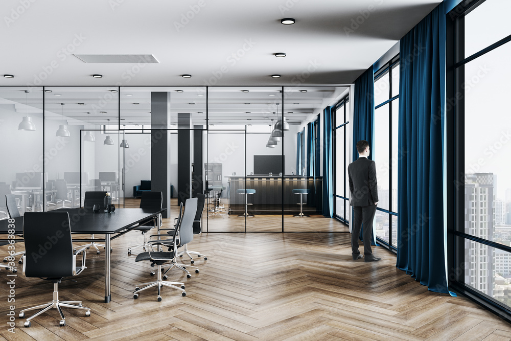 Businessman standing in office room with conference table - obrazy, fototapety, plakaty 