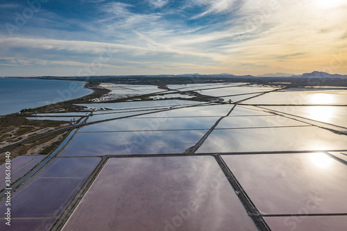 Evening aerial panoramic view Nature Reserve of Santa Pola Salt Lakes. Salt production and marshy area. Torrevieja. Costa Blanca. Province of Alicante. Spain