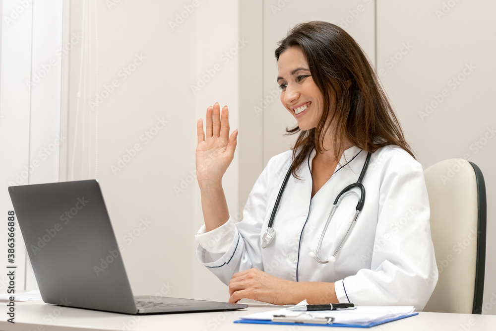 Female doctor wear white medical robe make online video call consult patient. Female doctor wear white medical robe make online video call consult patient.