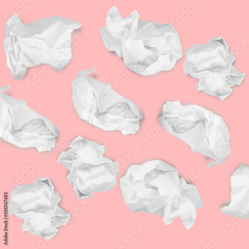 Paper Ball Crumpled Garbage Frustration. several crumpled sheets on a pink background pattern