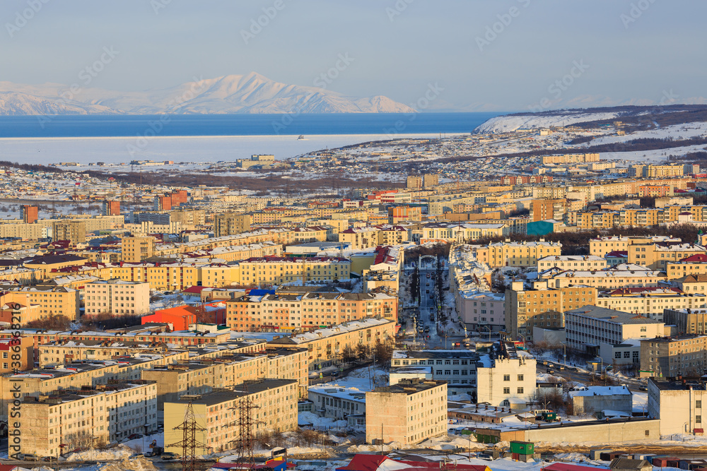 Top view of the city of Magadan. Portovaya street and the arch with the text in Russian 
