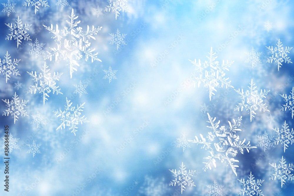 New Year and Christmas blurred soft card with snowflakes. Winter blue snow background.