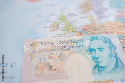 The United Kingdom on a European Map with a Five Pounds Banknote on Top photo