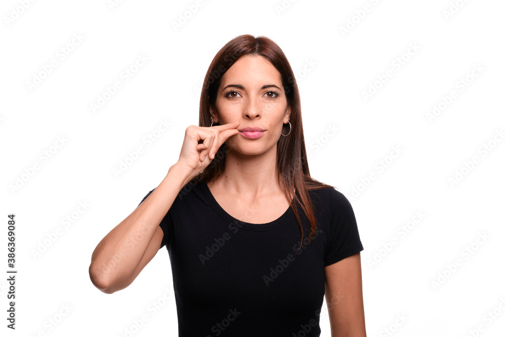 Isolated in white background brunette woman saying boy in spanish sign language Isolated in white background brunette woman saying boy in spanish sign language
