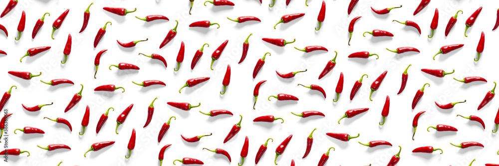 Creative background made of red chili or chilli on white backdrop. Minimal food backgroud. Red hot chilli peppers background. Creative background made of red chili or chilli on white backdrop. Minimal food backgroud. Red hot chilli peppers background.