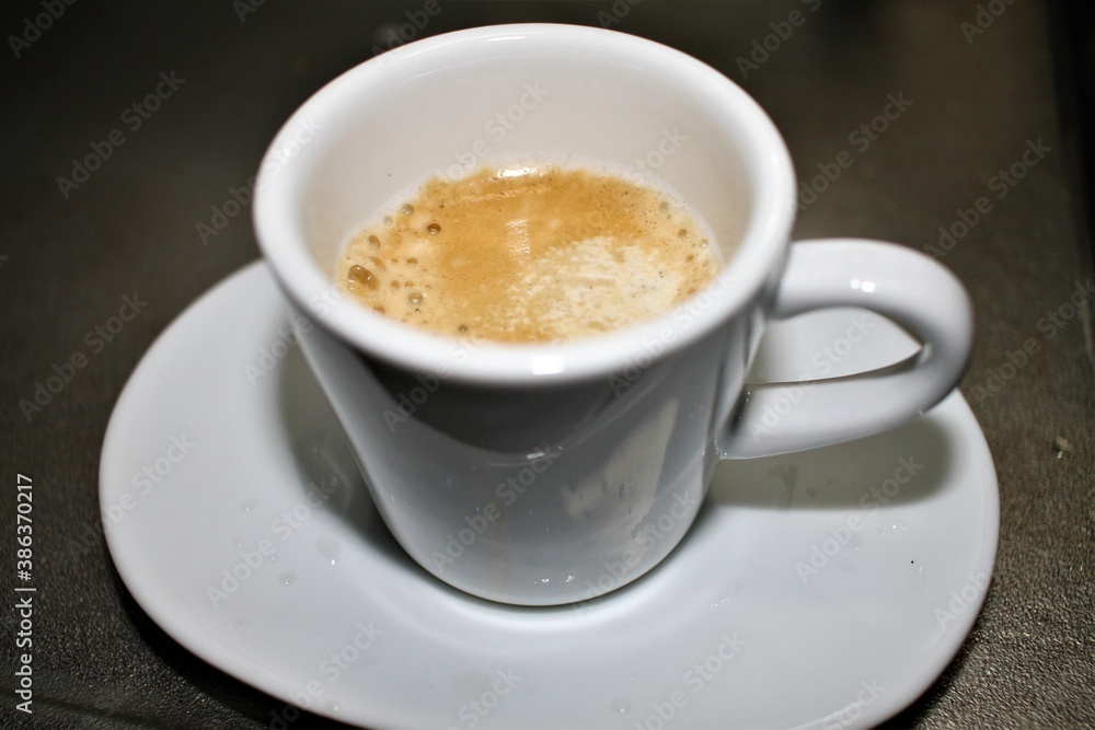 Sugar Dissolving in a Cup of Espresso Sugar Dissolving in a Cup of Espresso