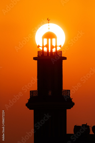 Sunrise and a Minaret in the morning   a view from Busiateen coast  Bahrain