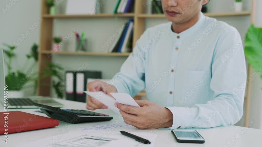 Image of a business man with financial concerns. Think hard about paying off credit card debt, house rent, and family expenses. Financial problem concept Image of a business man with financial concerns. Think hard about paying off credit card debt, house rent, and family expenses. Financial problem concept