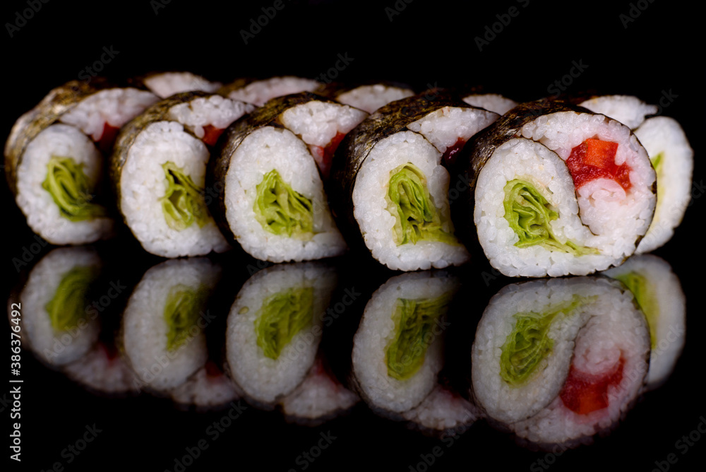 Fresh delicious beautiful sushi rolls on a dark background Fresh delicious beautiful sushi rolls on a dark background