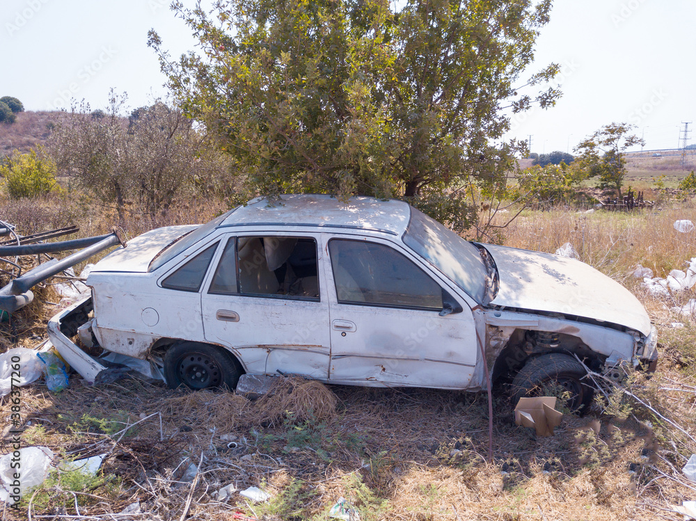 Abandoned rusty stolen cars in a junkyard. Scrap car. Abandoned rusty stolen cars in a junkyard. Scrap car.
